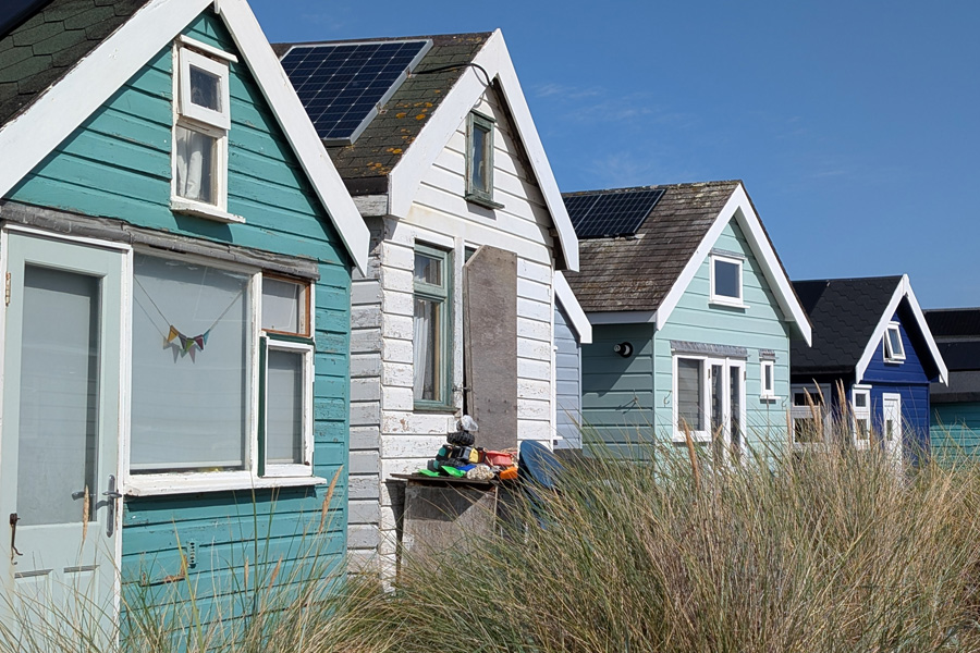 Beach huts line the dunes